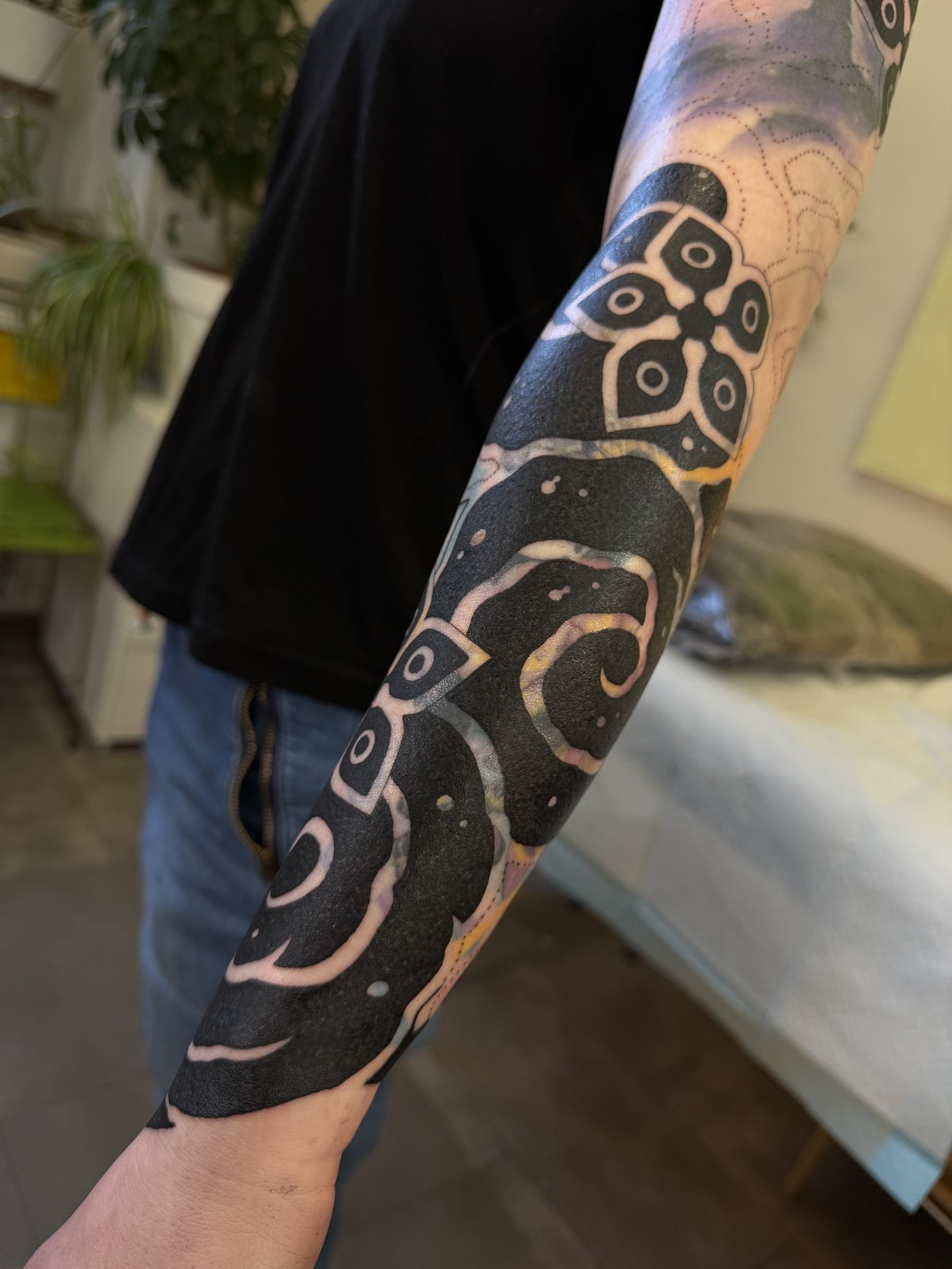 Heavy blackwork blast-over in progress, by Si, Bristol