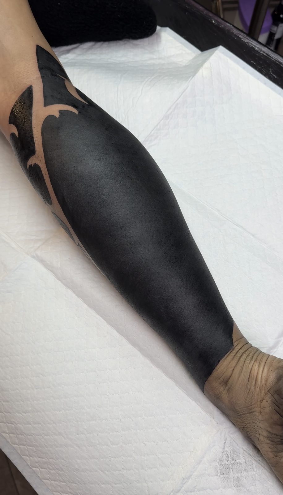 Finished neo-tribal blackout cover-up on the calf, by Si, Bristol